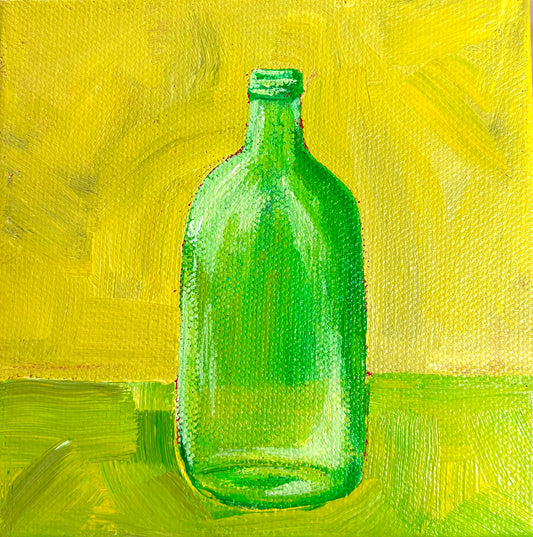 Green Bottle on a Green and Yellow Table