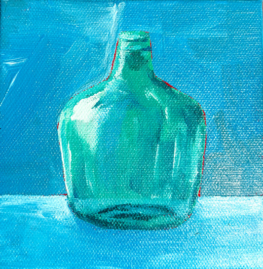 Green bottle on Blue Table